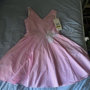 I am selling a vintage look dress, brand new, with built in underlay/slip.